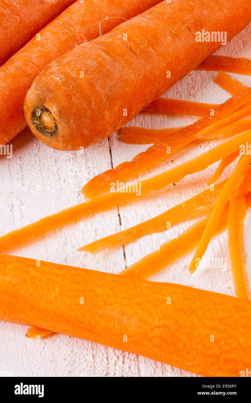 Fresh peeled carrots sliced into thin batons for carrot julienne with a