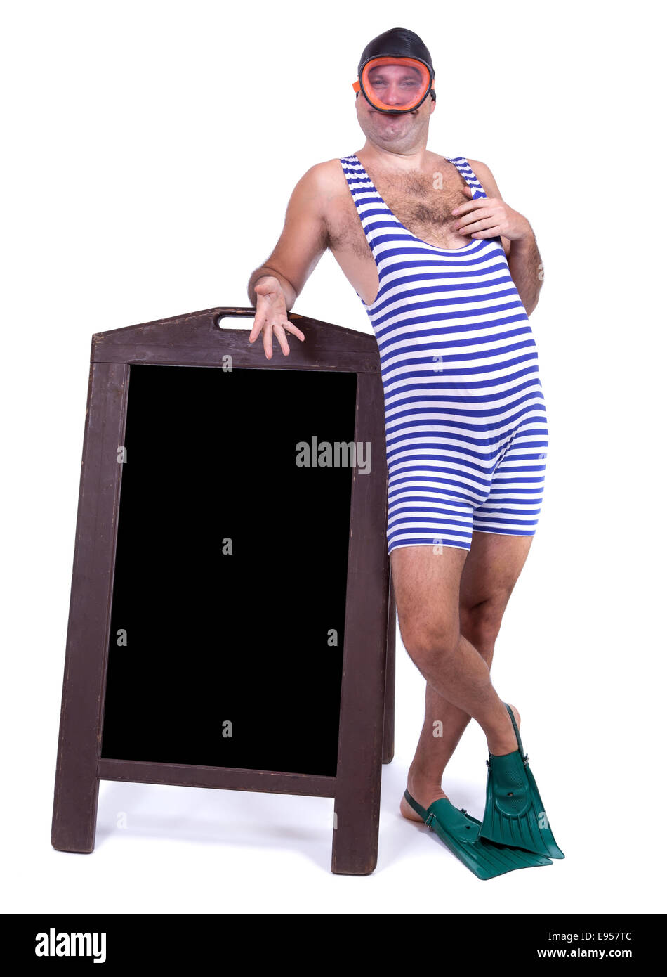 Man in swimsuit standing beside menu Stock Photo