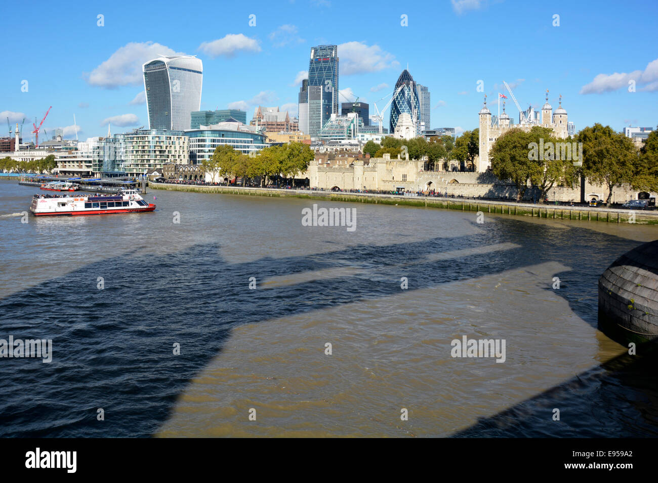 Tower Bridge shadow cast onto the waters of the River Thames at high ...