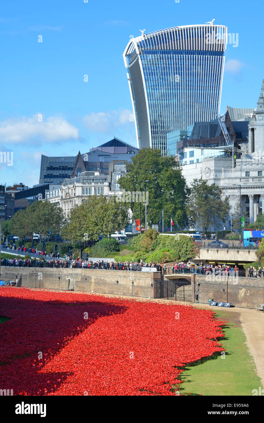 Field of Ceramic Poppies World War 1 remembrance tribute in the dry moat at Tower of London with Walkie Talkie building beyond Stock Photo
