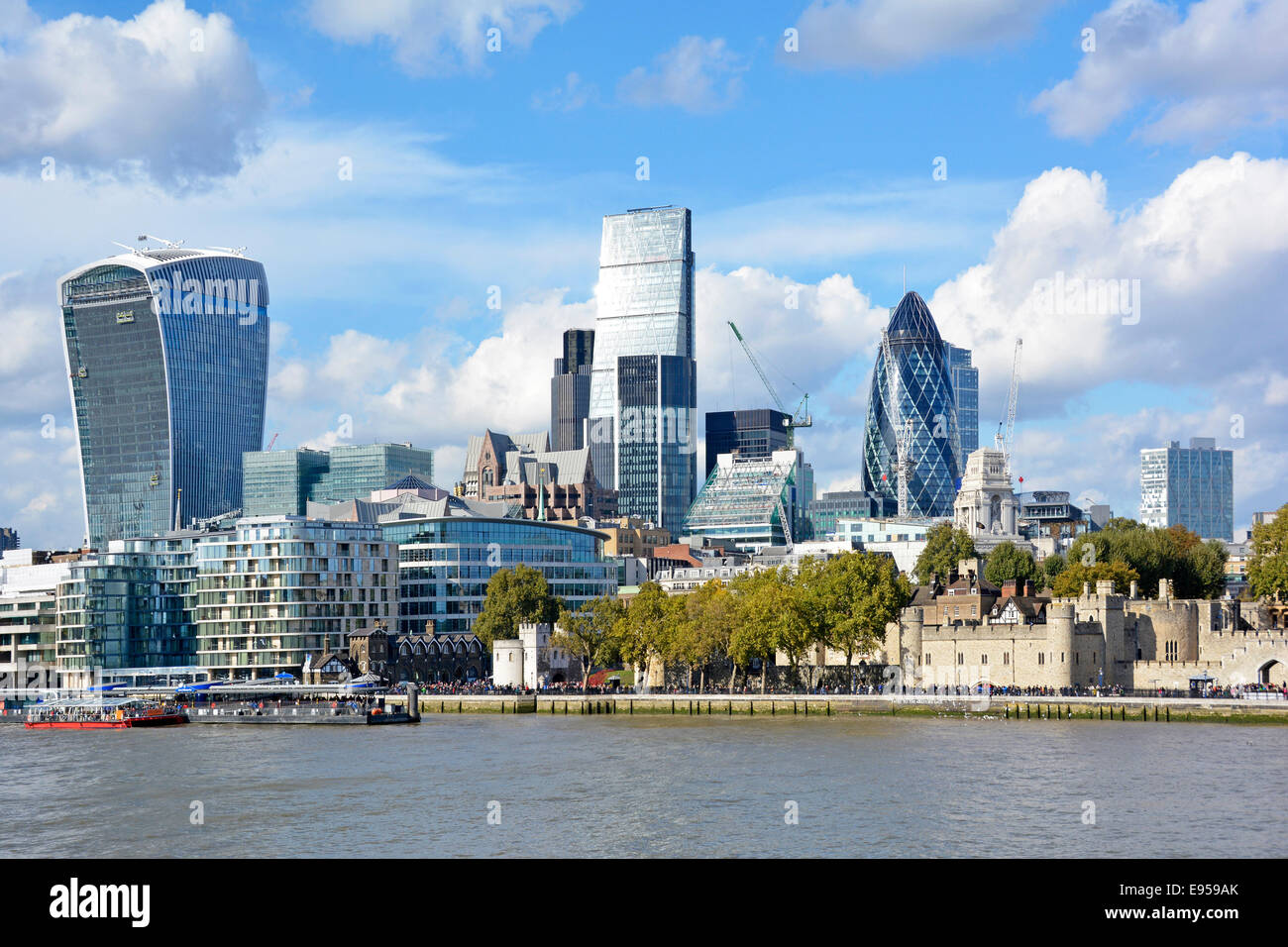 Gherkin Cheesegrater and  Walkie Talkie skyscraper office blocks dwarf the ancient Tower of London Stock Photo
