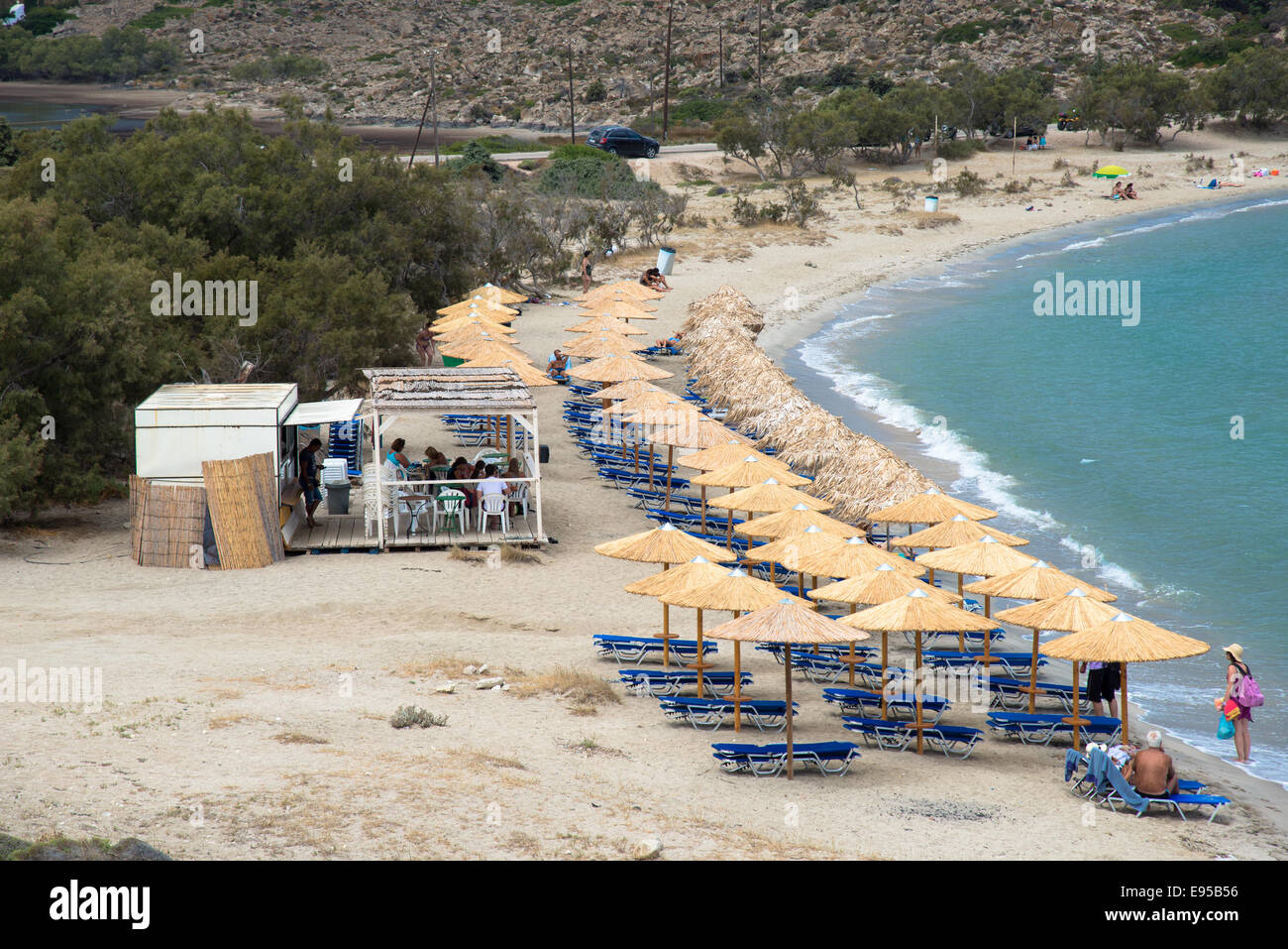 rows of parasols at the beach of Kanava at Milos, Greece Stock Photo - Alamy