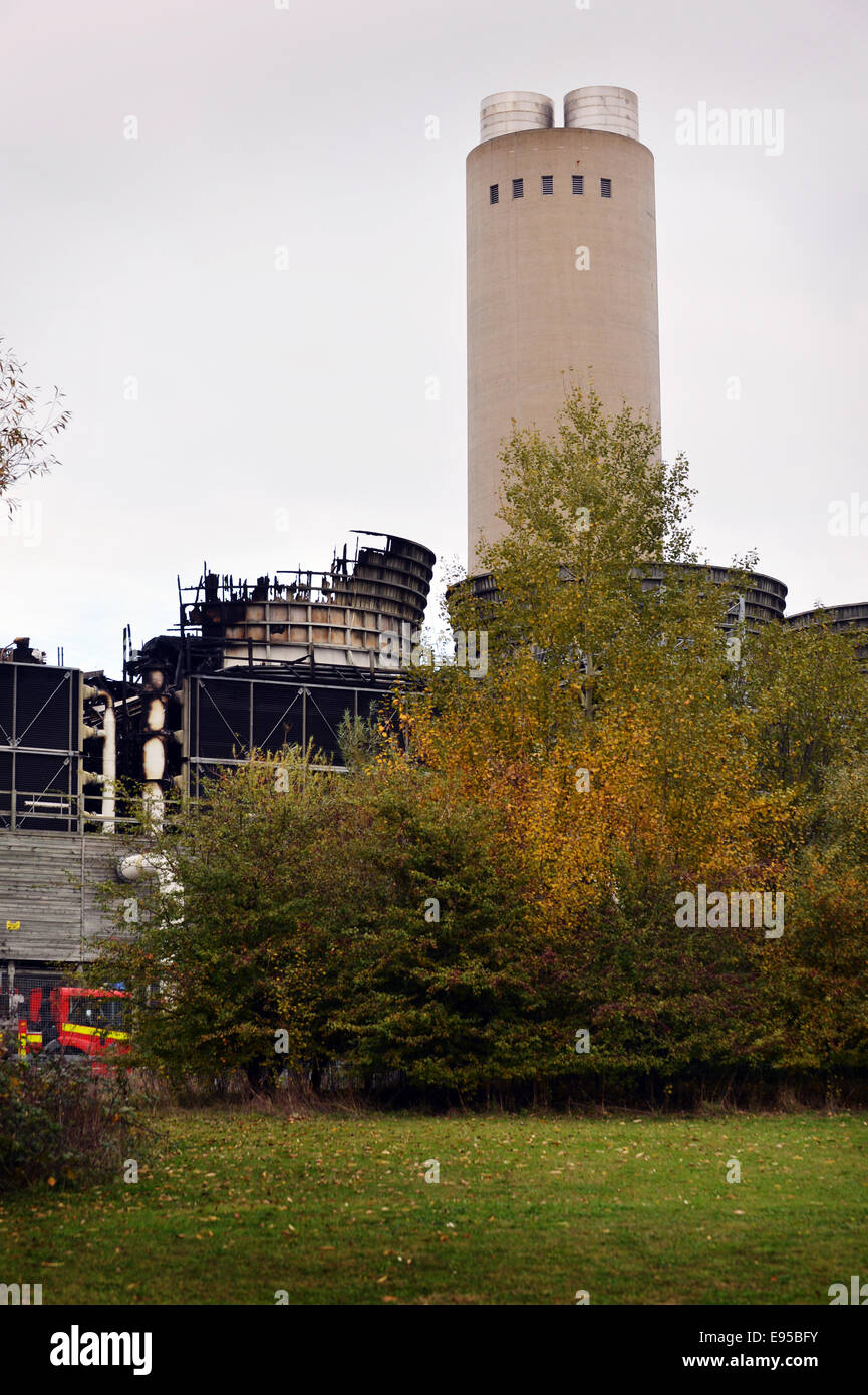 Didcot, UK. 20th Oct, 2014. Two fire service units remain at the Didcot B power station site which is owned by RWE npower after a fire blazed through the cooling towers Sunday evening. Investigation crews (pictured) are inspecting the scene. photos by Sidney Bruere/Alamy Live News Stock Photo