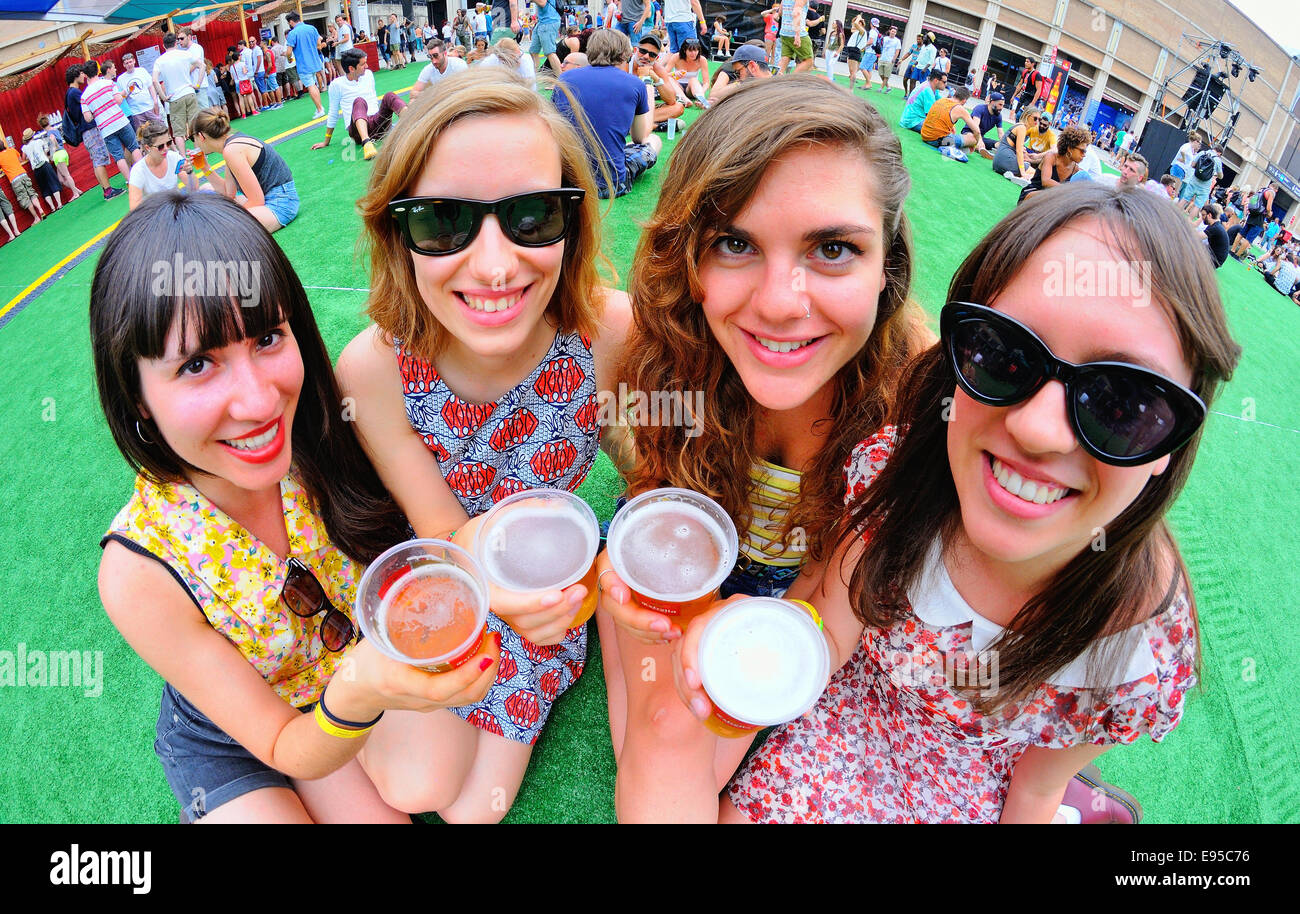 BARCELONA - JUN 12: Girls holding beer glasses at Sonar Festival on June 12, 2014 in Barcelona, Spain. Stock Photo