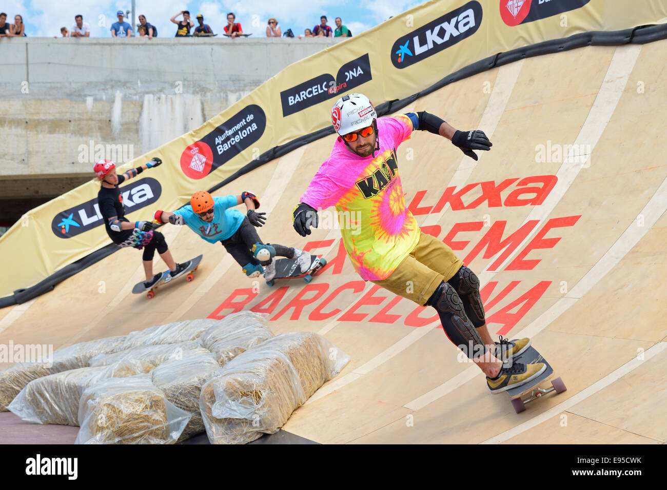 BARCELONA - JUN 28: Professional riders at the Longboard Cross competition at LKXA Extreme Sports Barcelona Games. Stock Photo