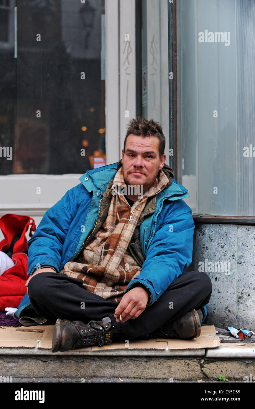 A homeless man sat in a doorway in Brighton Stock Photo