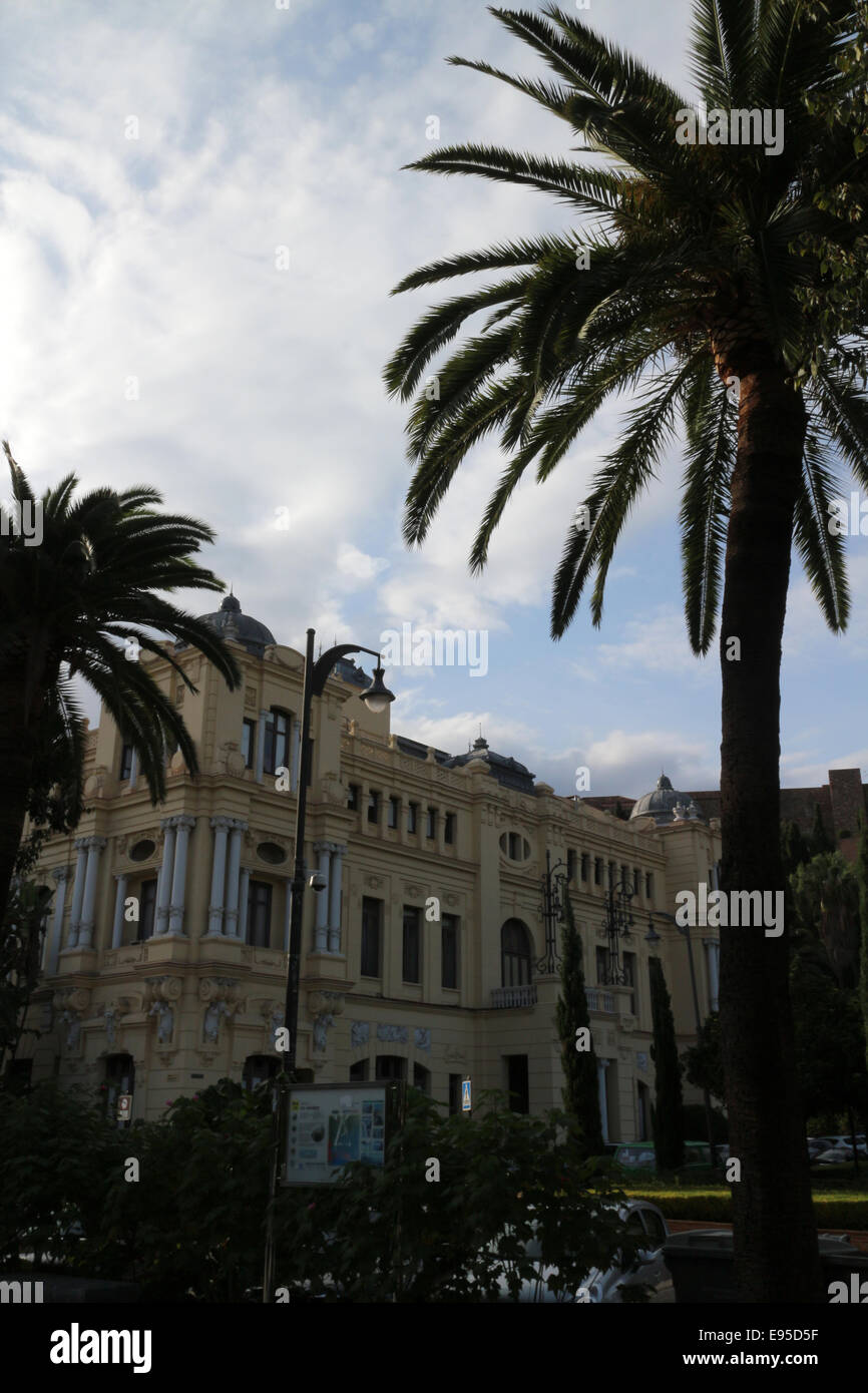 Malaga city council building and silhouette of palm trees City of