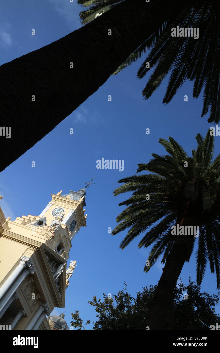 Malaga city council building and silhouette of palm trees City of