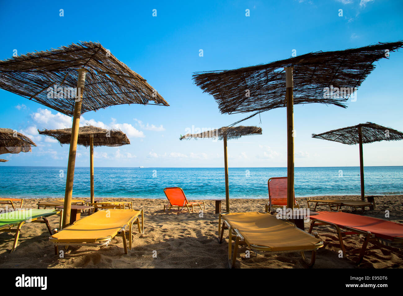 parasols at beach of paliochori milos greece Stock Photo