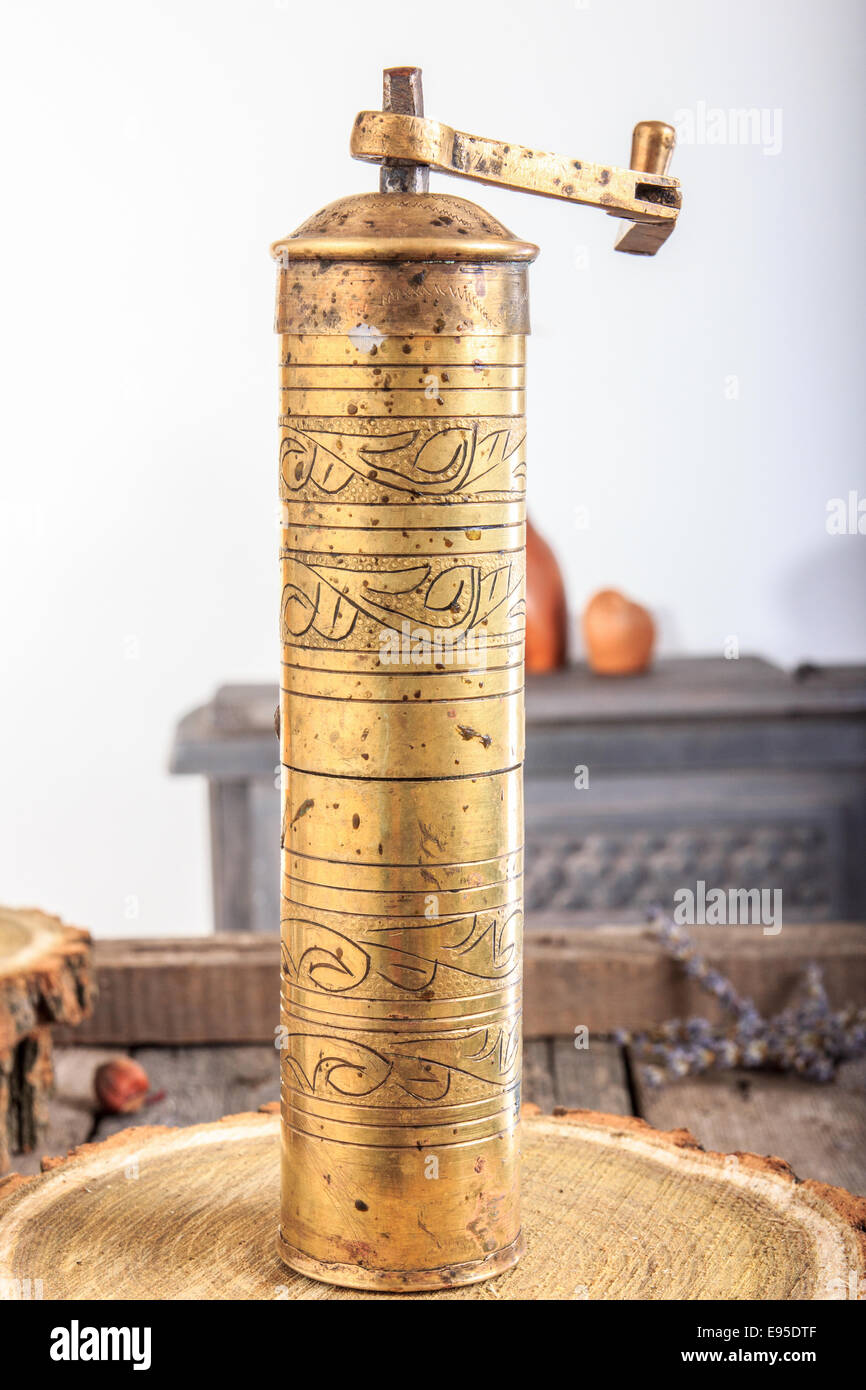 https://c8.alamy.com/comp/E95DTF/antique-golden-coffee-grinder-on-old-wooden-table-vintage-manual-coffee-E95DTF.jpg