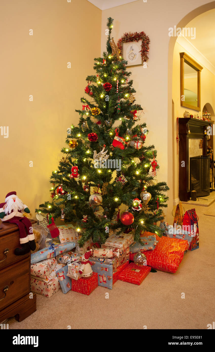 Christmas tree and presents at home Stock Photo