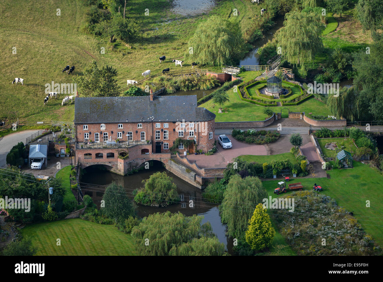 An aerial view of a large mill-house in the Cheshire countryside Stock Photo