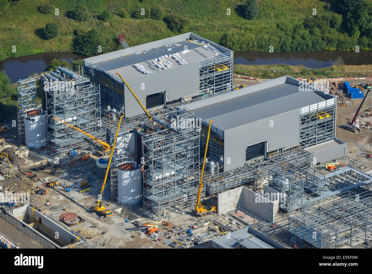 An aerial view of an industrial construction project next to a river in northern England. Stock Photo