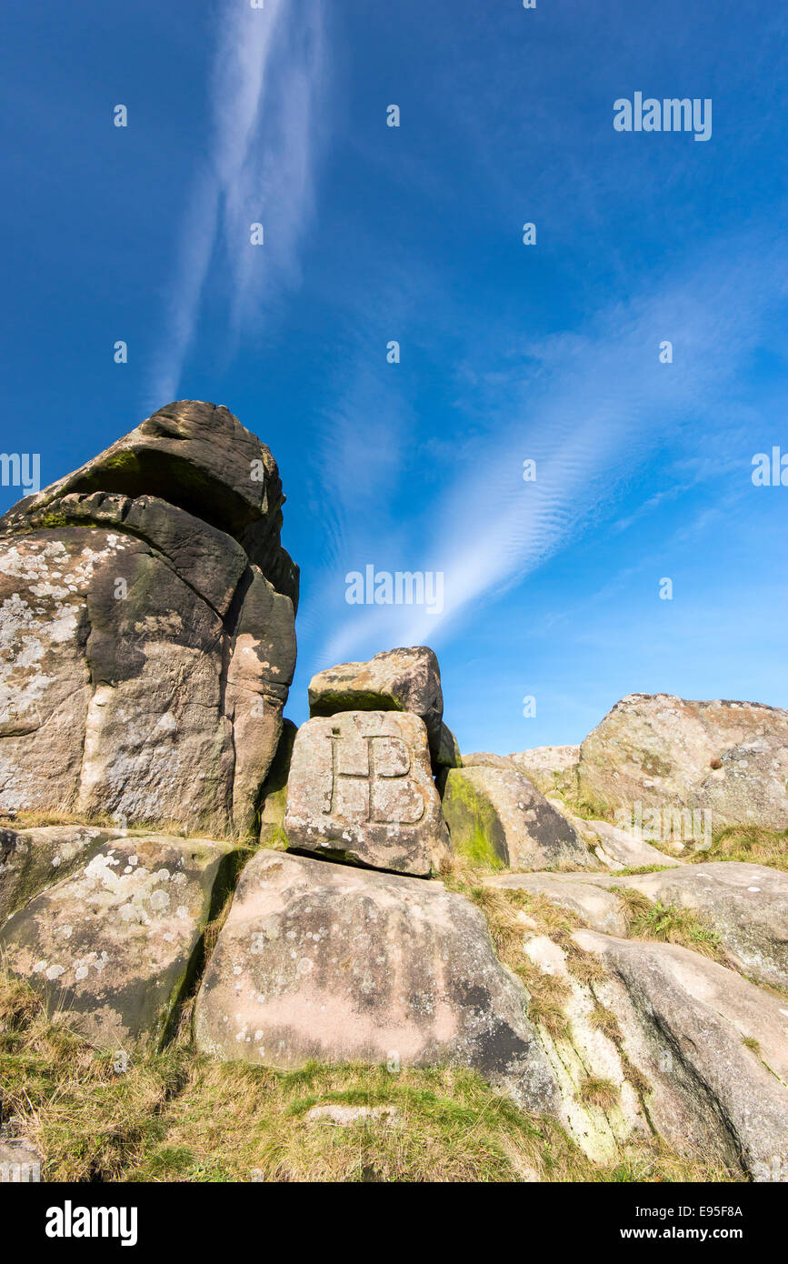 Rocks at Robin Hoods stride below deep blue sky and high wispy clouds. Peak District, Derbyshire. Stock Photo
