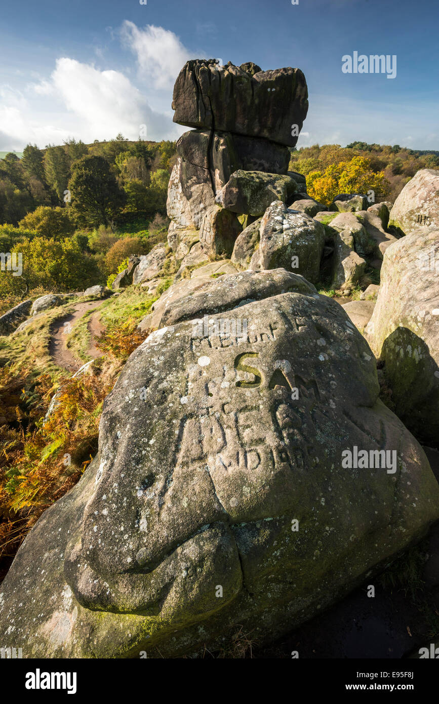 Graffiti on the rocks at Robin Hoods stride in the Peak District, Derbyshire, England. A sunny autumn day. Stock Photo