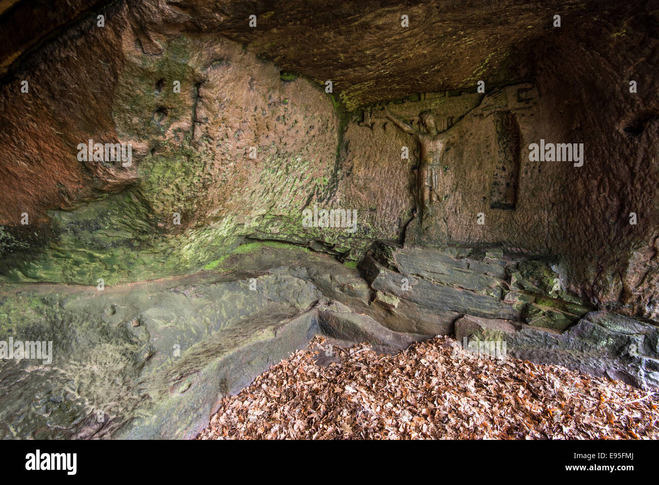 Carving of Christ on the cross, Hermits cave near Elton in the Peak District, Derbyshire. Stock Photo