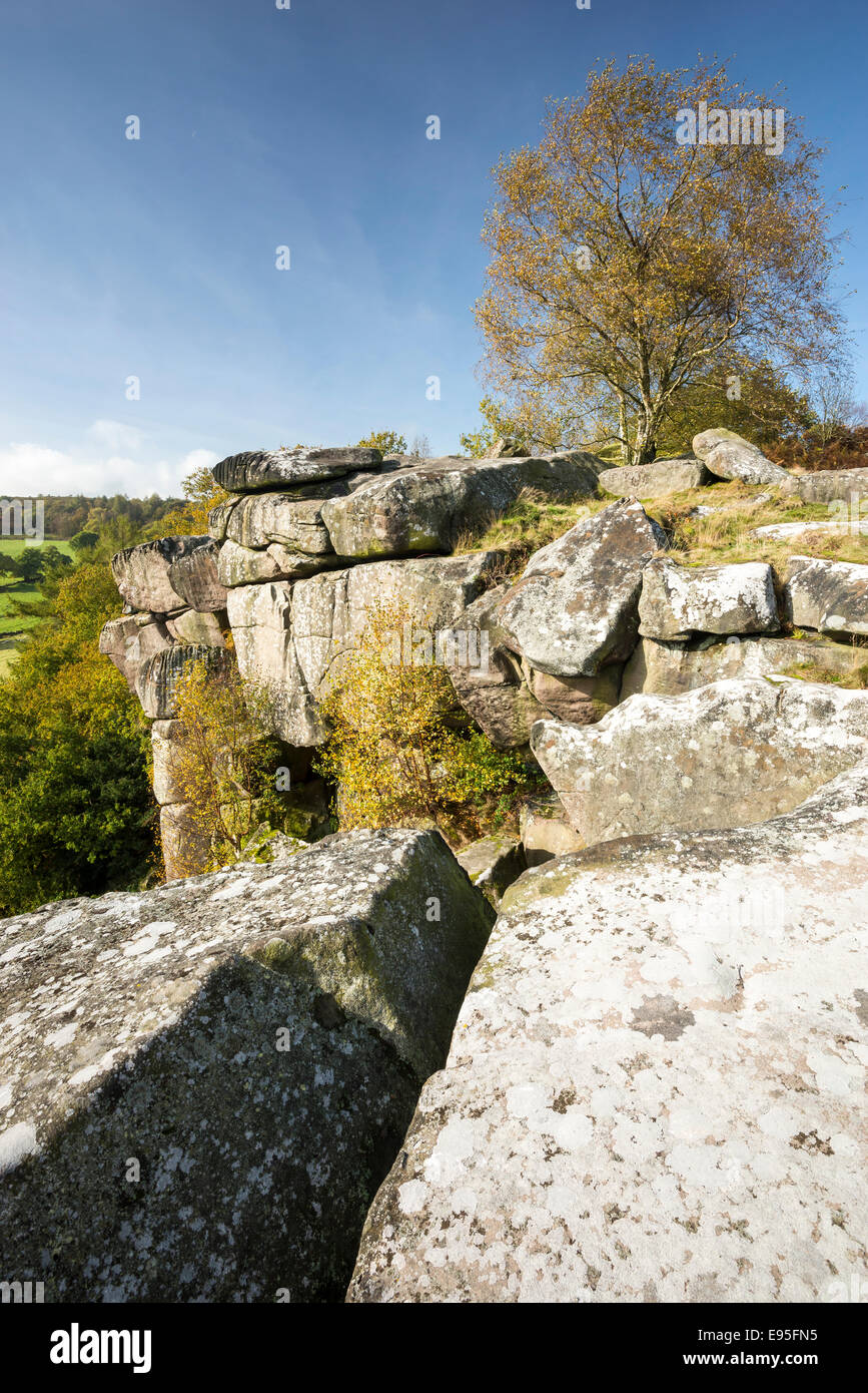 Cratcliffe Tor near Elton in the Peak District on a sunny autumn day. Edge of the rocky cliff. Stock Photo