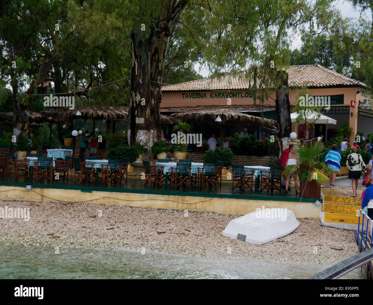 Taverna on the beach at  Karavomilos Greece. Stock Photo
