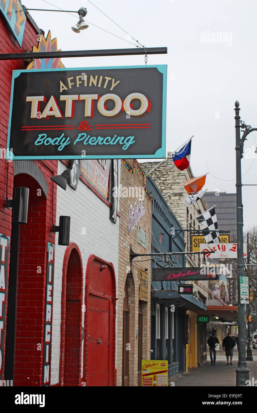 Sign for Affinity Tattoo parlor on historic 6th Street in the downtown entertainment district of Austin, Texas Stock Photo