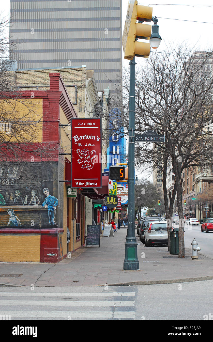 Signs for businesses along historic 6th Street in the downtown entertainment district of Austin