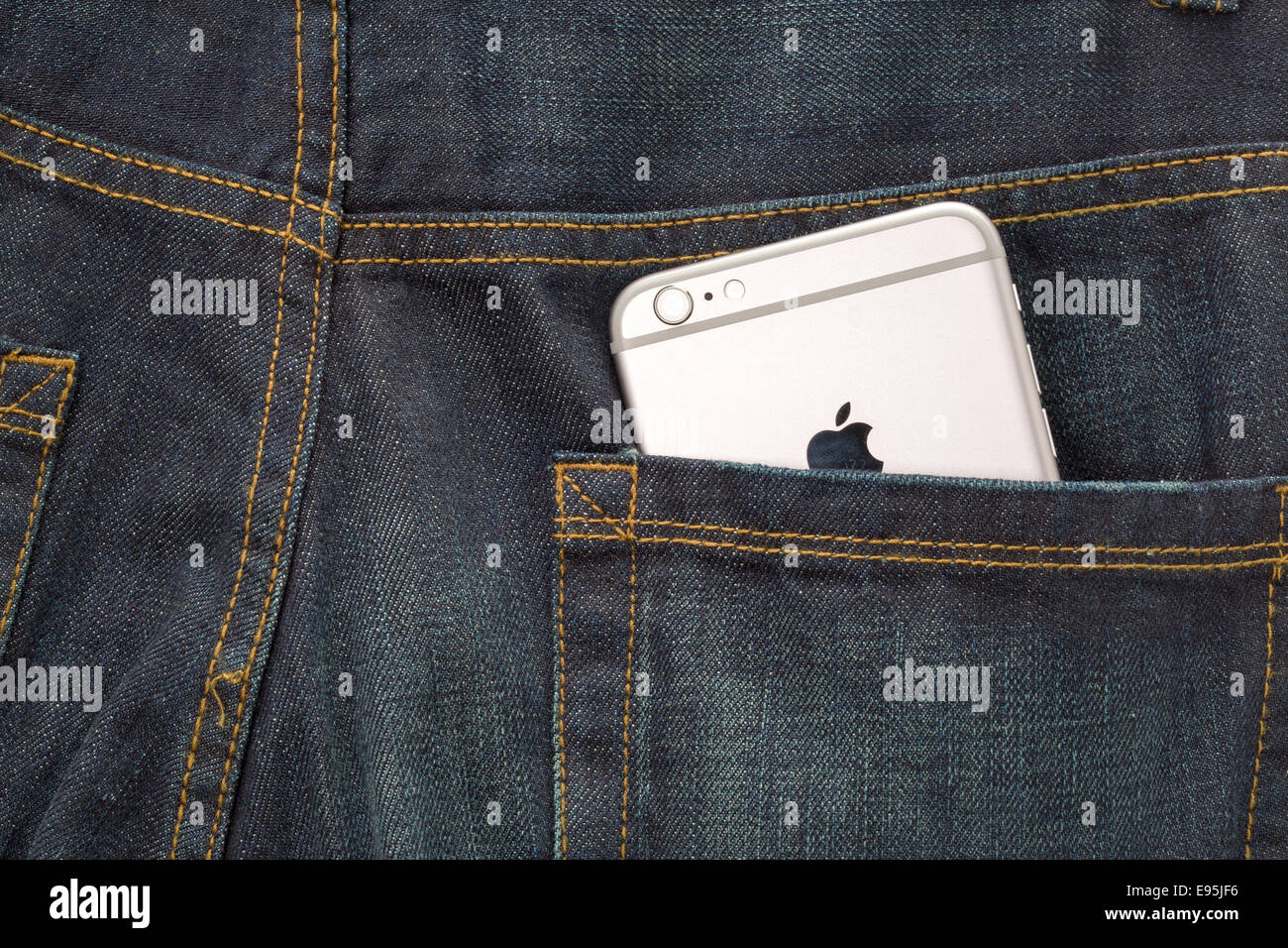 A new Apple iPhone 6 in the back pocket of a pair of denim jeans Stock Photo