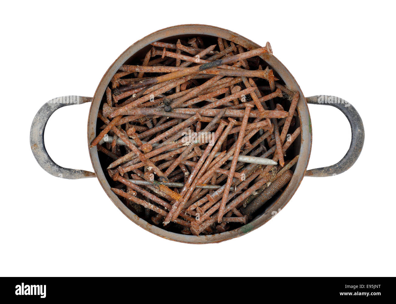 old saucepan full of rusty nails Stock Photo