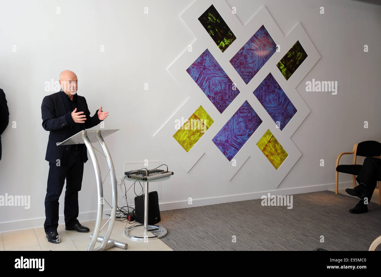 Brian Eno with his artwork 77 Million Paintings on display in the reception area of The Montefiore Hospital in Hove Stock Photo