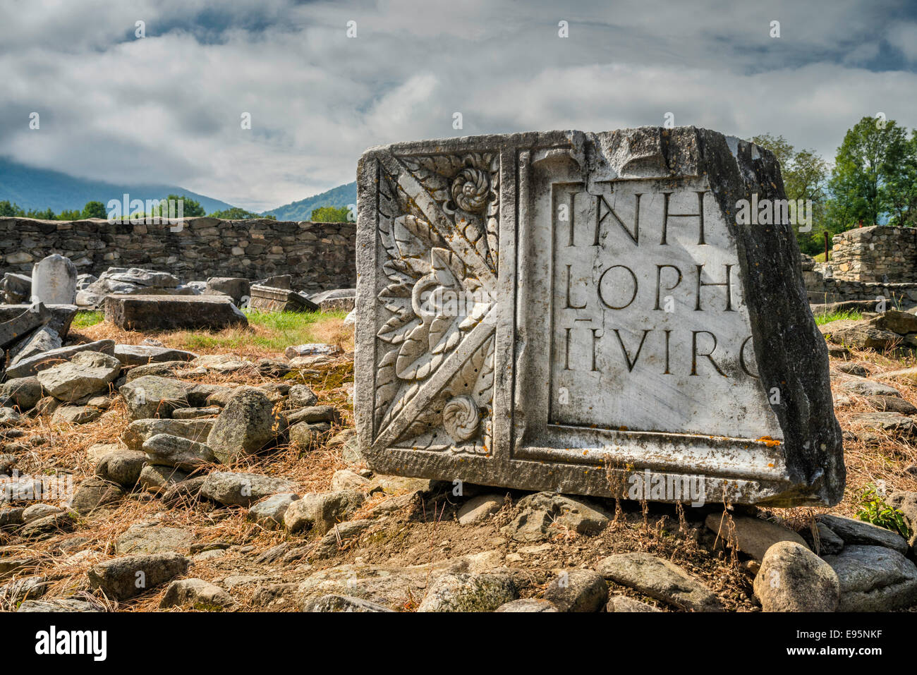 Fragment of frontispiece with Latin inscription at Forum in Ulpia Traiana, in village of Sarmizegetusa, Transylvania, Romania Stock Photo