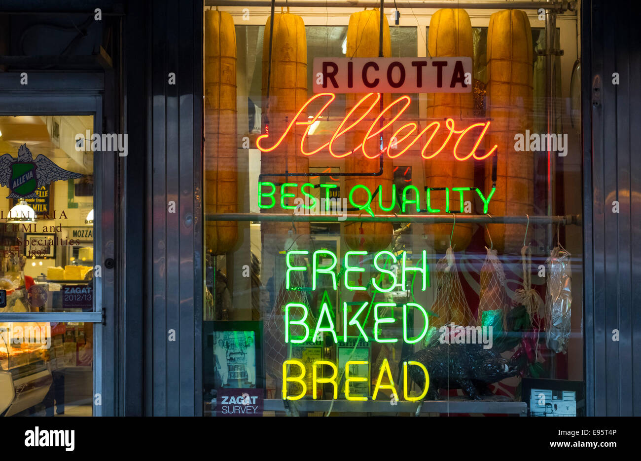 Neon window sign in Alleva cheese shop and Italian deli in Little Italy in New York City Stock Photo