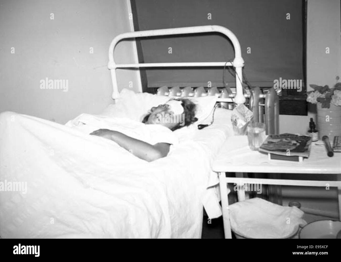 One lying woman hospital bed Black and White Stock Photos & Images - Alamy