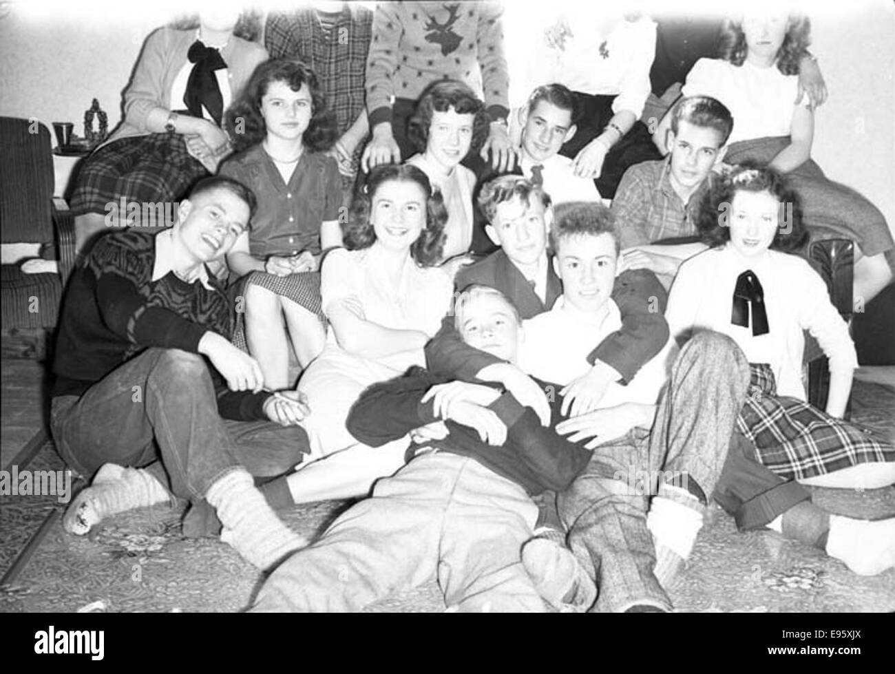 Young people posing for a group shot. March 1948 21/4 x 31/4 negative This is one of 54 photos in the album “Fort Macleod’s Anonymous”. Most are shot in Fort Macleod, Alberta in the late 1940s. The donor of the p Stock Photo
