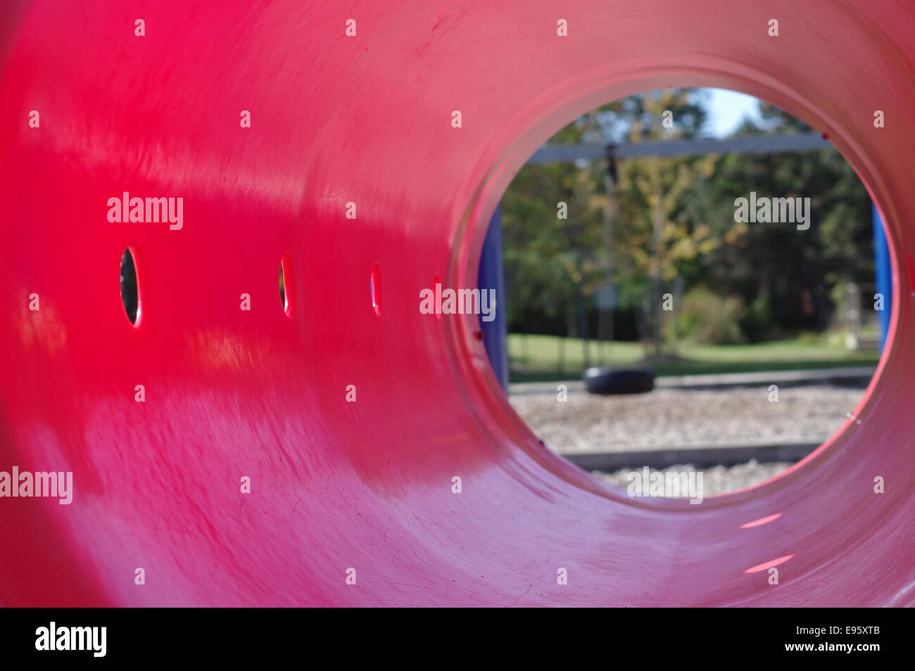 View of schoolyard playground - play tunnel Stock Photo