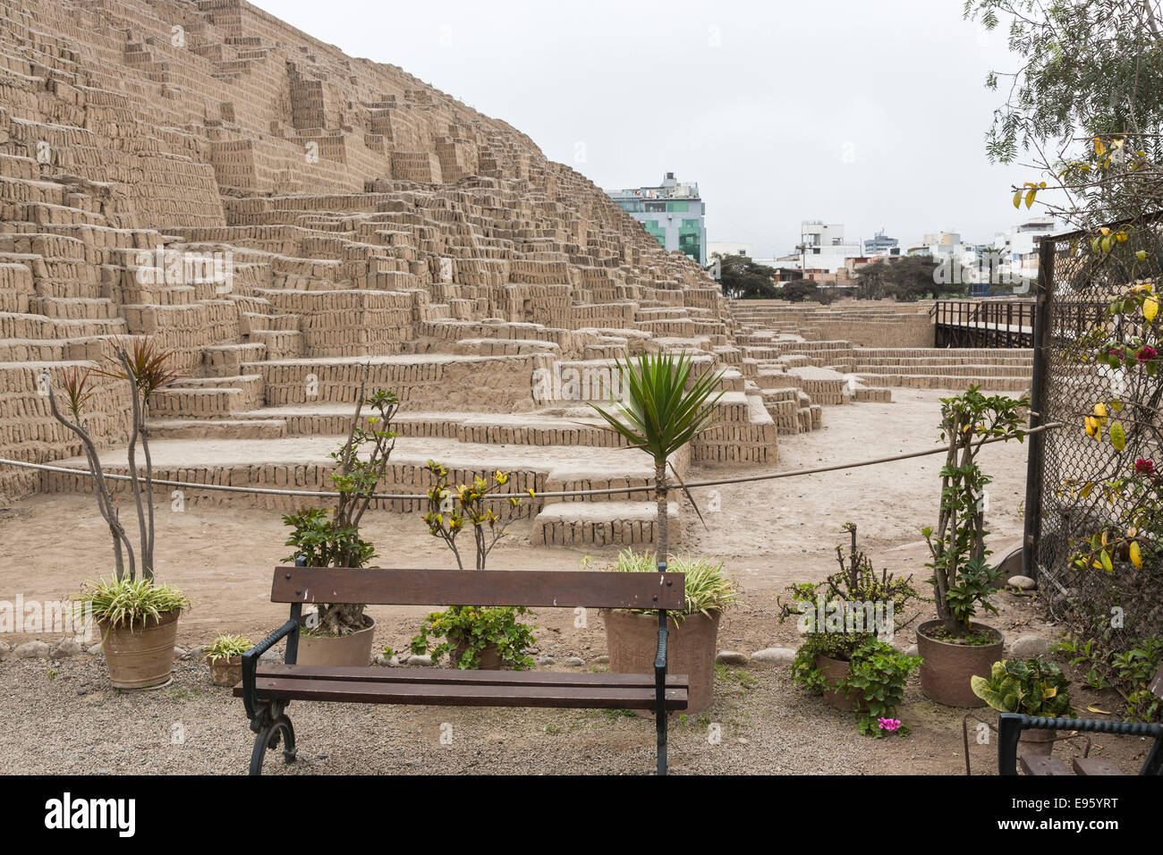 Pre-Inca pyramid at Huaca Pucllana or Huaca Juliana, Miraflores, Lima, Peru with modern Miraflores buildings in the background Stock Photo