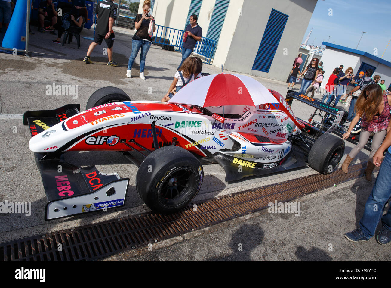 People taking pictures with Levin Amweg's car of ART Junior Team at Jerez racetrack Stock Photo