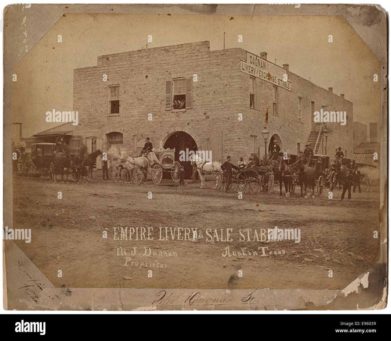 This photograph shows the Empire Livery & Sale Stable in Austin, Texas, with M. J. Dagnan as the proprietor. It captures the historic U.S. Western livery business and transportation hub during the early 20th century. Stock Photo
