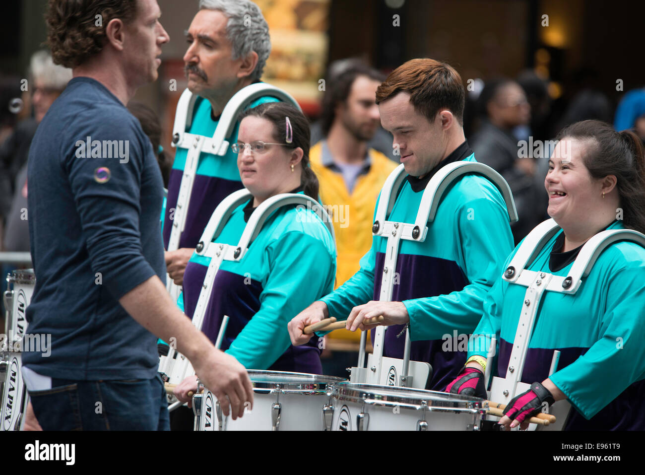 Special Needs children taking an active part in the Columbus Day Parade in New York City 2014, with their teacher present. Stock Photo