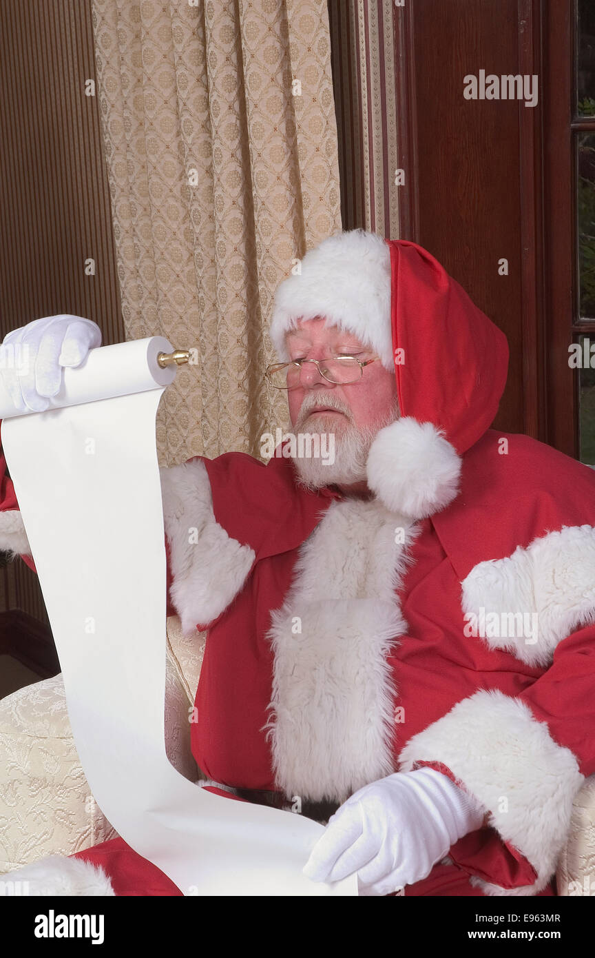 Santa checking his list at least twice Stock Photo - Alamy