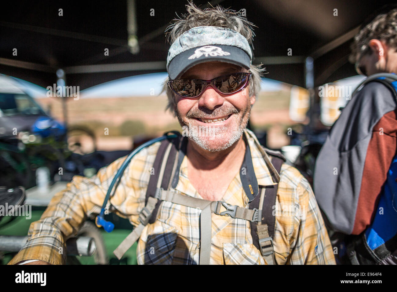 Man smiling at the camera during a mountain biking event in Moab, Utah. Stock Photo