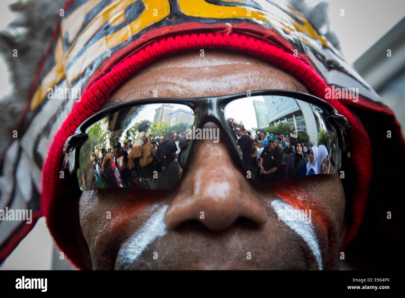 Jakarta, Indonesia. 20th Oct, 2014. Participant from Papua Join the celebration. Jokowi inauguration celebration held arround Hotel Indonesia roundabout to Indonesian Palace as the new president riding Indonesian traditional horse-drawn carriage called 'Kereta Kencana'. Credit:  Donal Husni/Alamy Live News Stock Photo