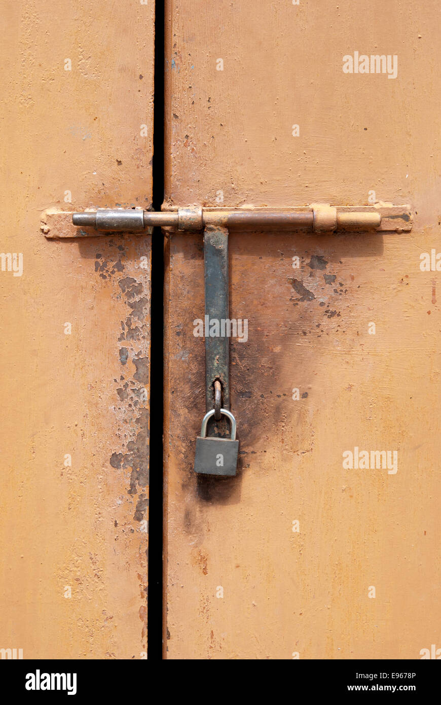 closeup metal door with lock in grungy style Stock Photo