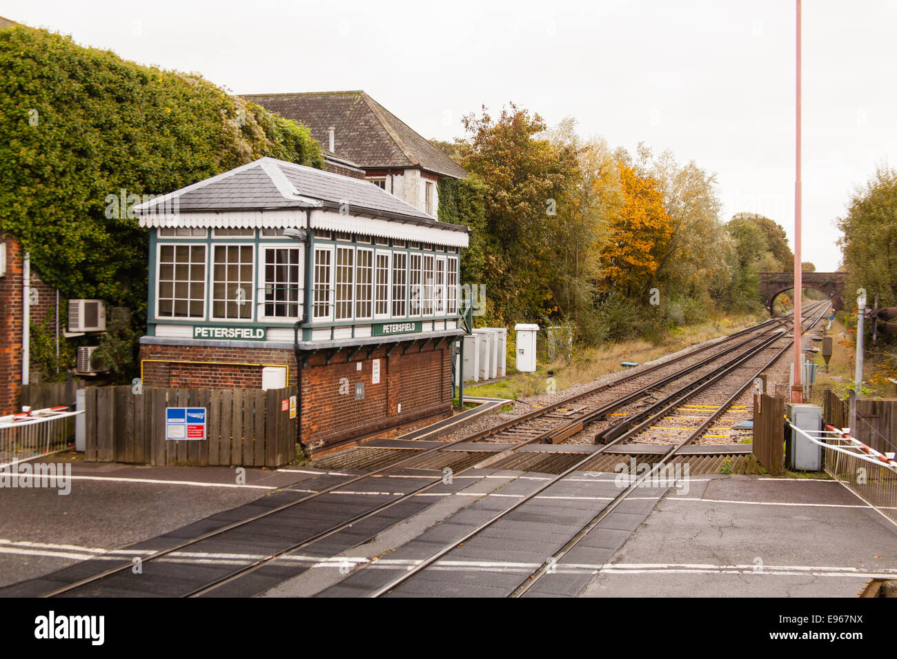 Level crossing and Type 3 Signal Box, Petersfield station, Hampshire, England, United Kingdom. Stock Photo