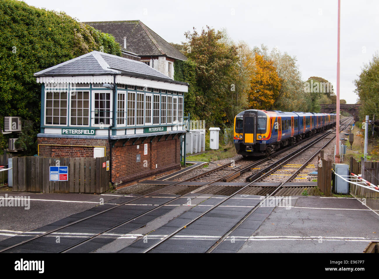Level crossing and Type 3 Signal Box, Petersfield station, Hampshire, England, United Kingdom. Stock Photo