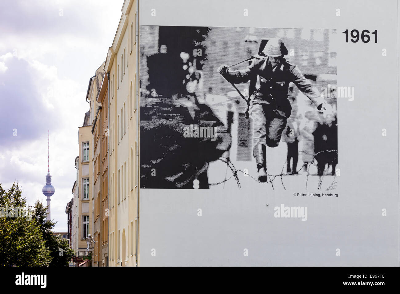 Iconic photo of soldier jumping over barbed wire on wall on Bernauer