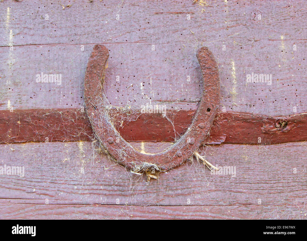 Old lucky horseshoe on brown wooden wall Stock Photo Alamy