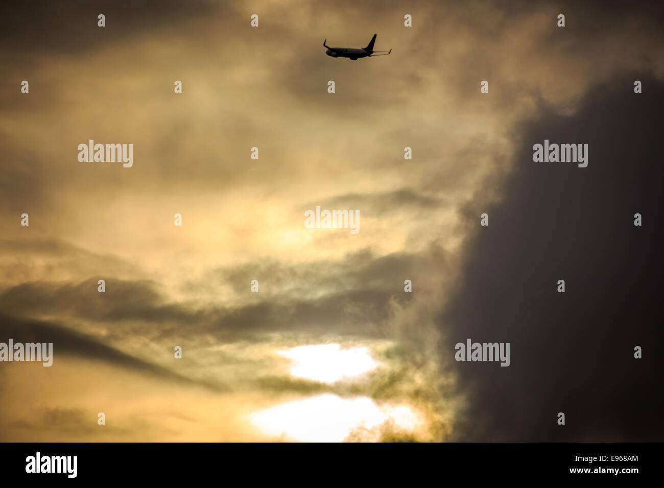 Airplane take off at sunset Stock Photo