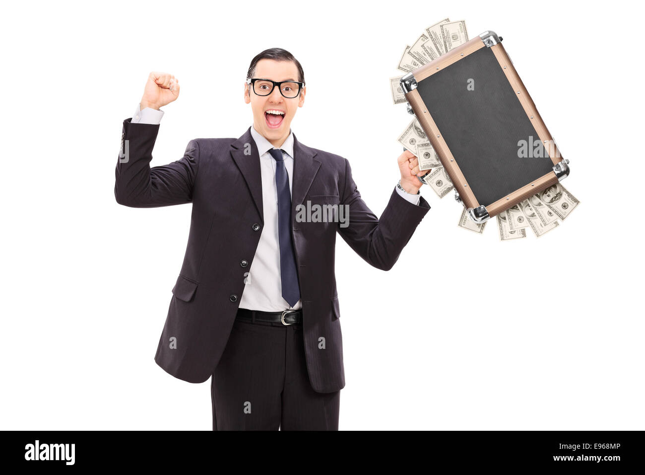 Excited businessman holding a bag full of money isolated on white ...