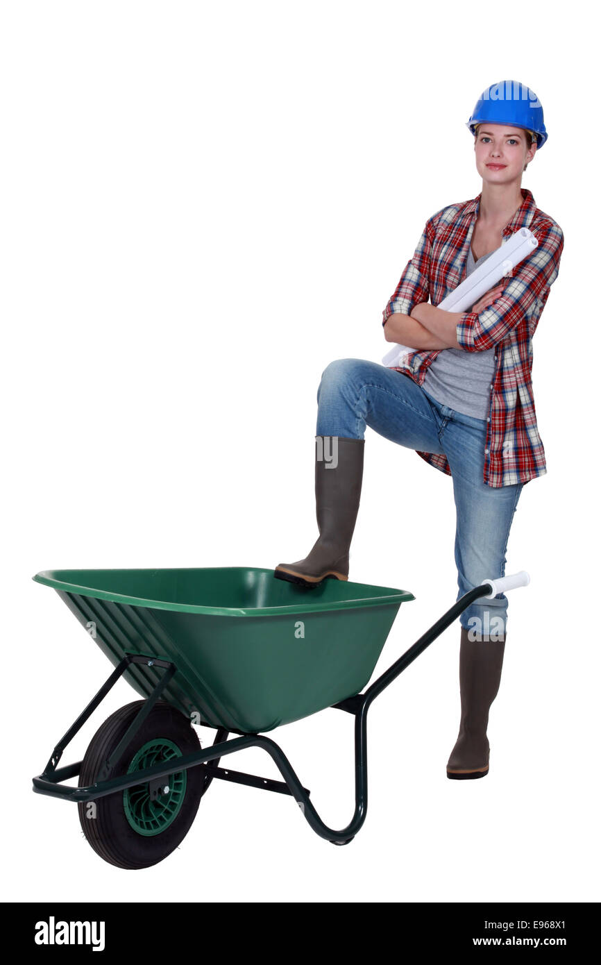 Tradeswoman with a wheelbarrow Stock Photo