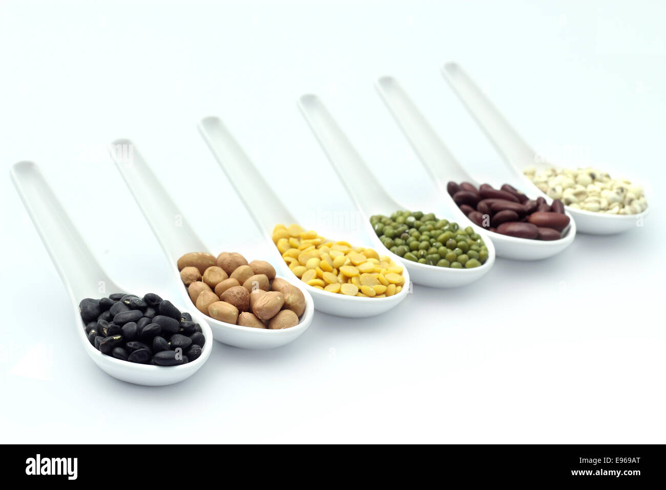 cereal in spoon on a white background. Stock Photo