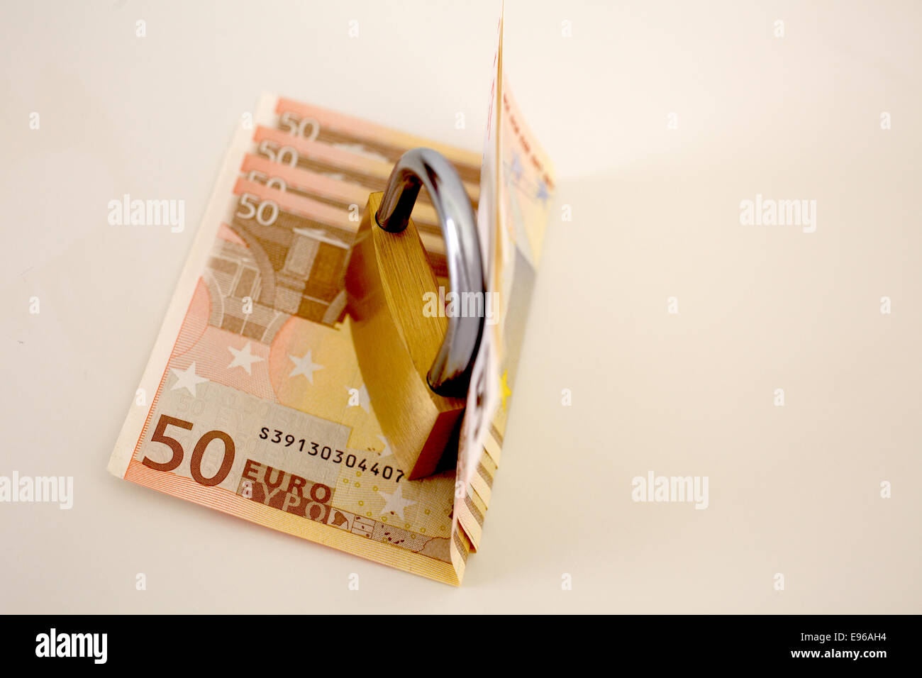 Euro currency cash with padlock isolated on a white background concept locked financial security Stock Photo