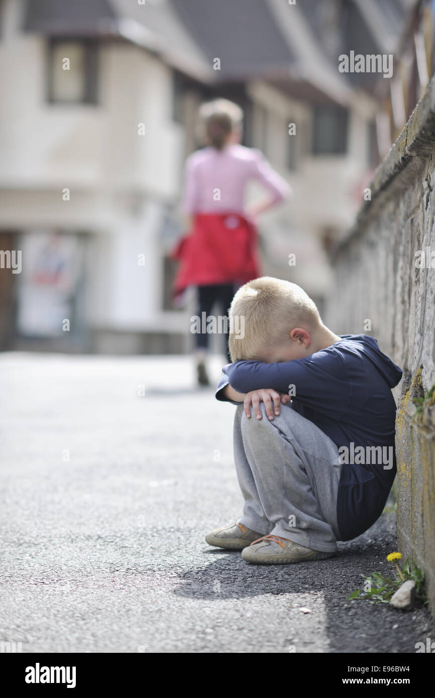 sad lonely boy on street Stock Photo - Alamy